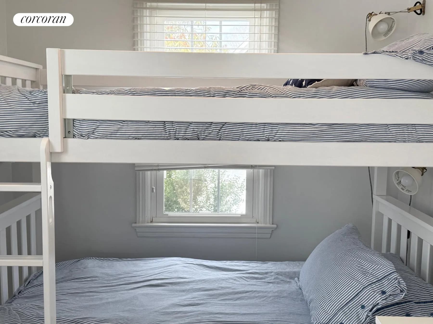 Second bedroom with twin bunk beds and blue striped bedding